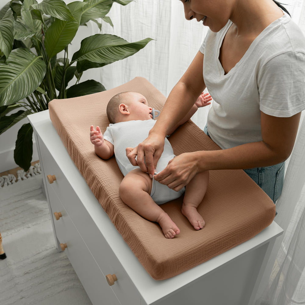 Comfy Cubs universal-fit changing pad cover showing elastic edges for secure placement.