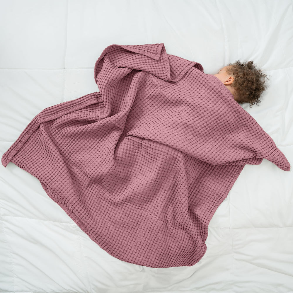 Comfy Cubs waffle blanket in stroller setup for on-the-go comfort