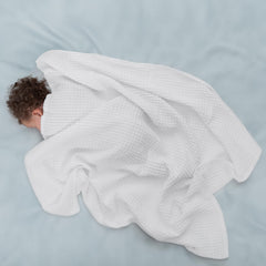 Close-up of waffle pattern on Comfy Cubs blanket for breathable baby comfort.