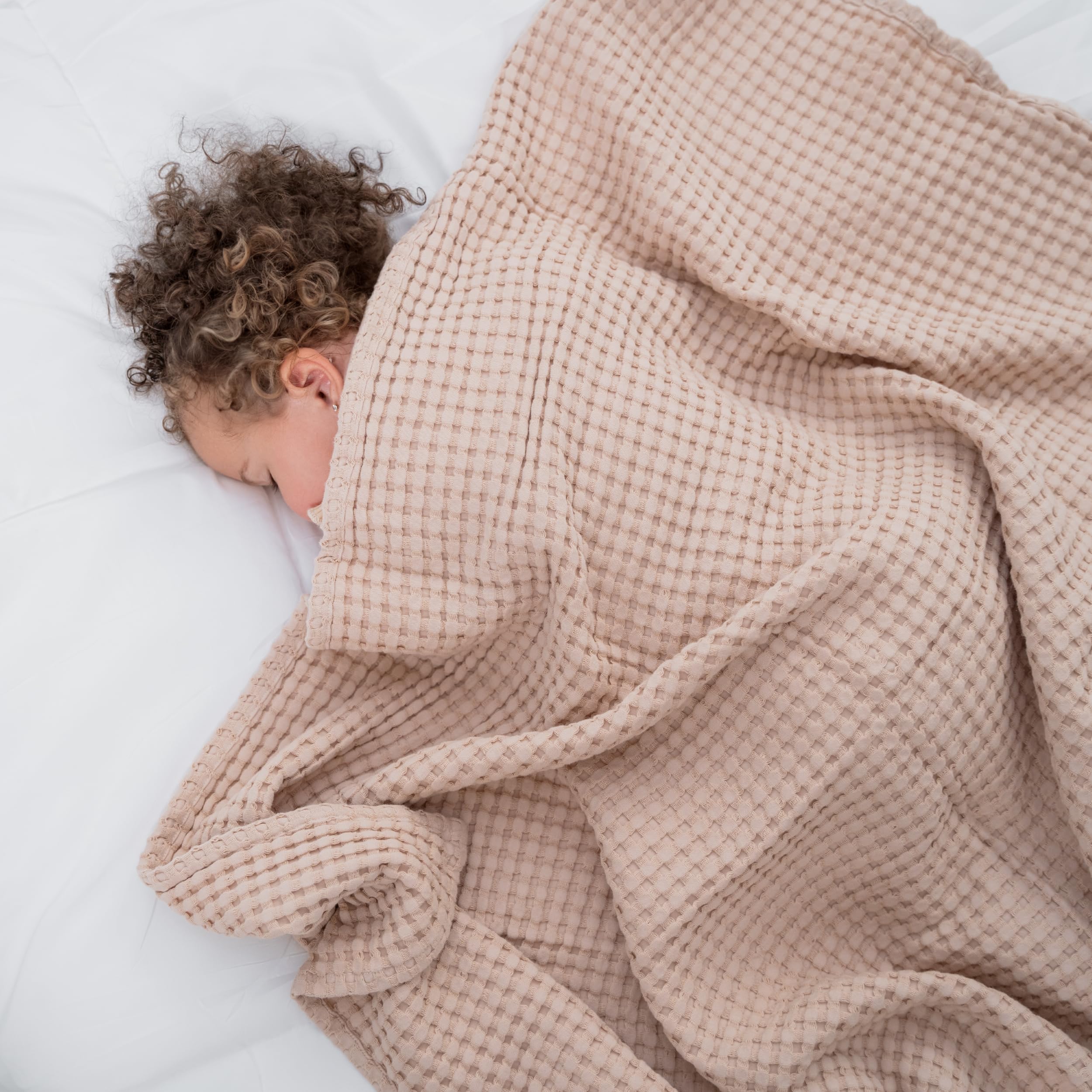 Comfy Cubs waffle blanket in blush color for cozy nursery decor