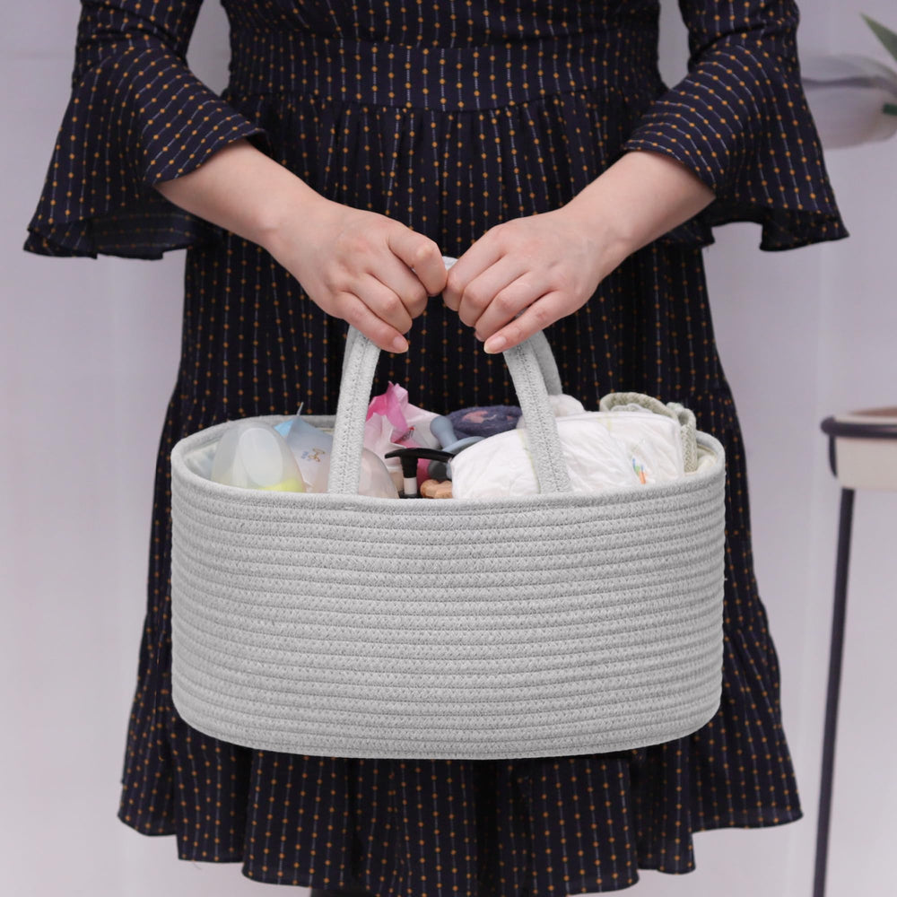 COMSE diaper caddy on changing table with removable dividers for quick access to diapers and wipes.