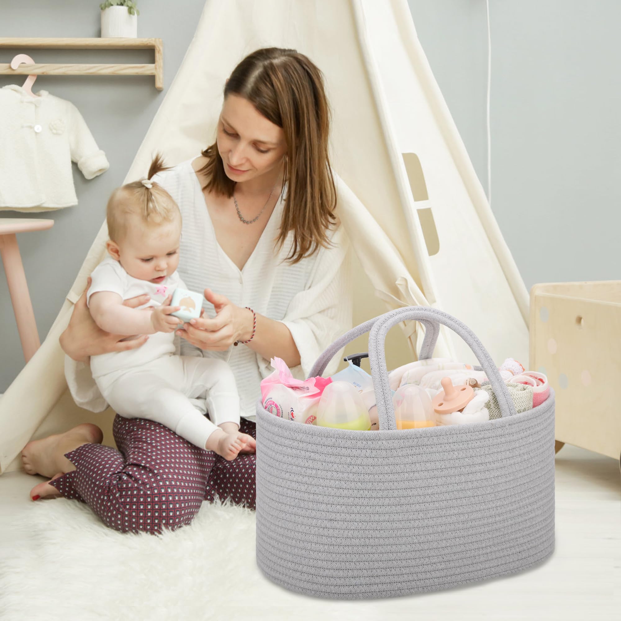 COMSE nursery basket in cool gray stores lotions, bibs, and toys within arm's reach.