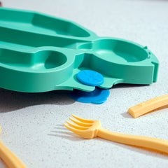Constructive Eating suction base plate shown securing to a high chair.
