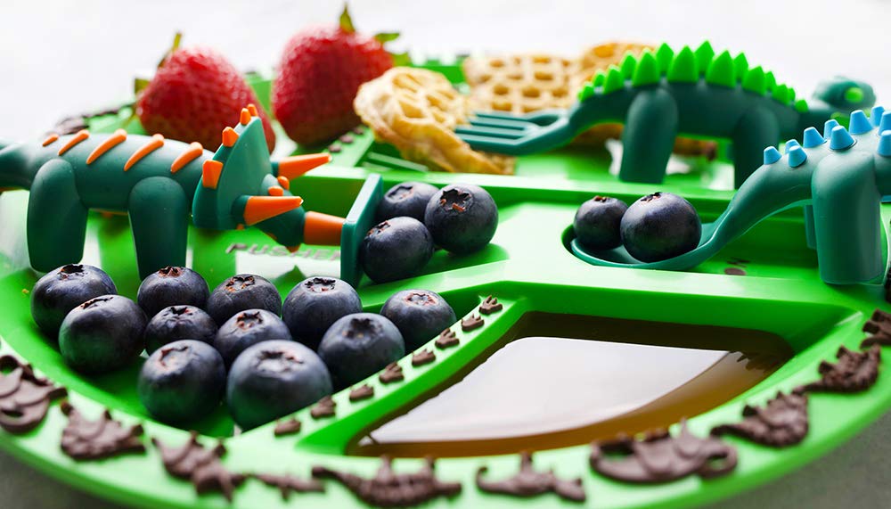 Constructive Eating dinosaur-themed mealtime set arranged for kid-friendly dining.