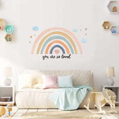 Containlol rainbow wall decal being applied to smooth surface; easy to peel.