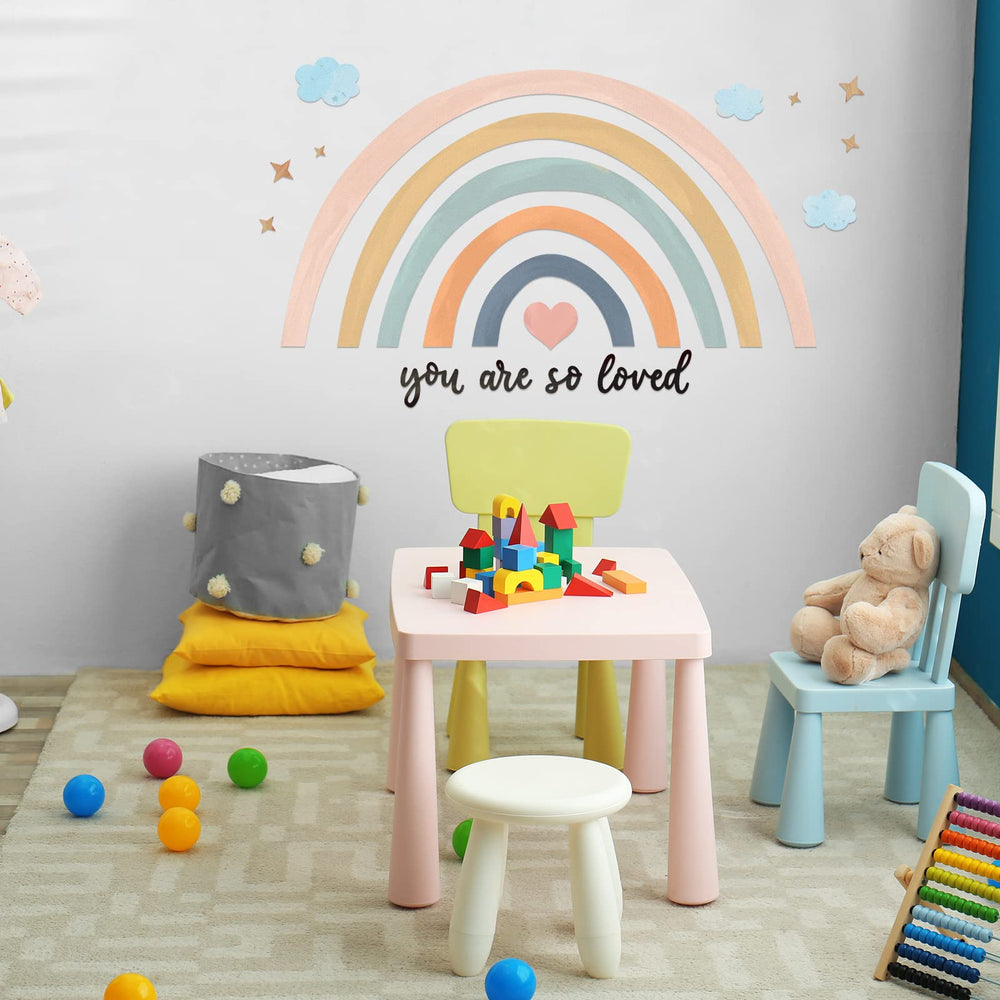 Containlol rainbow wall decal kids applying in playroom; inspires creativity.