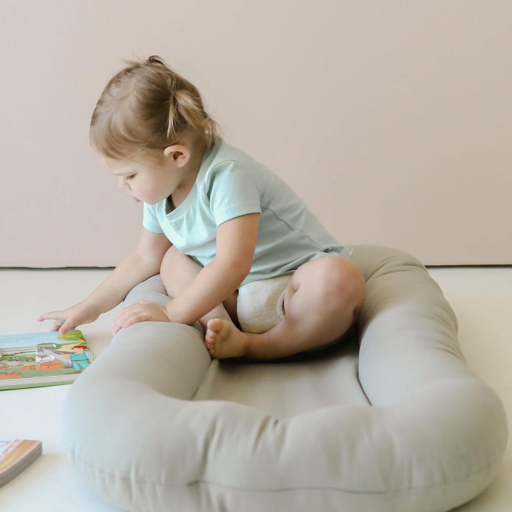 CooCooBaby baby nest cover with soft cotton detail supports gentle lounging.