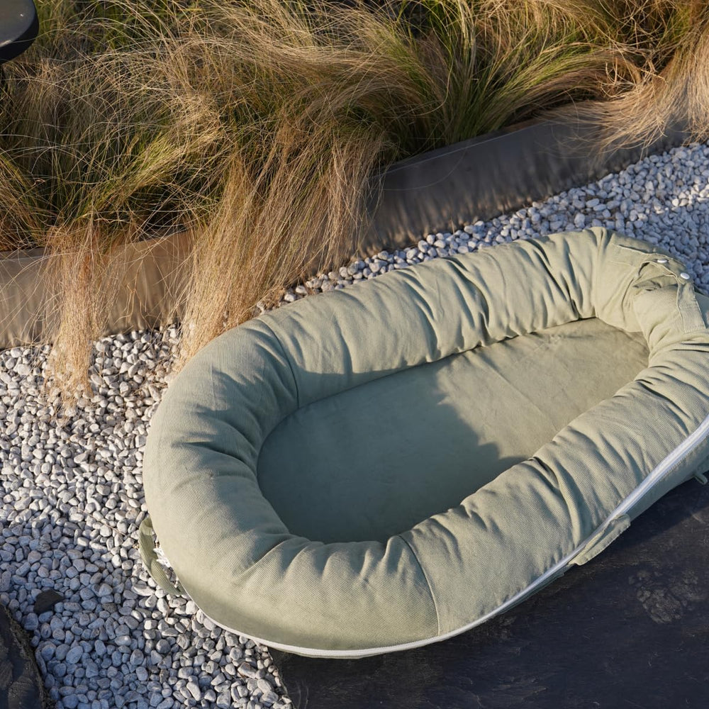 Cozy, safe lounging space in a nursery or living room setting.