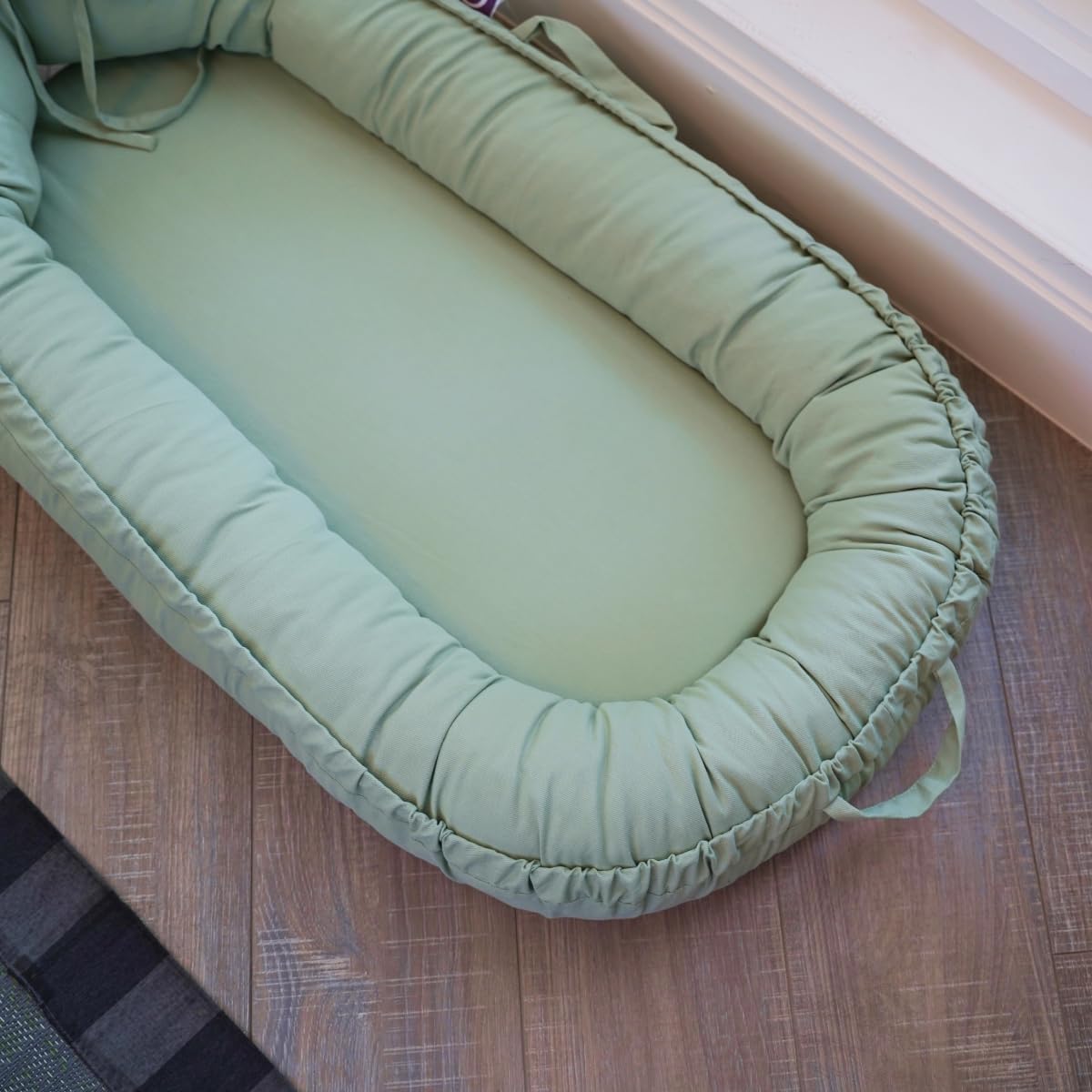 CooCooBaby infant lounger eco-friendly design supporting sustainable parenting