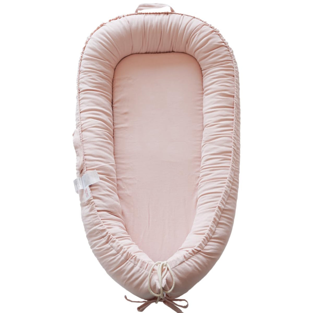 CoocooBaby infant lounger in mistyrose corduroy cover offers breathable lounging comfort.