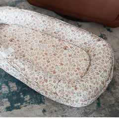 CooCooBaby travel-friendly lounger shown in compact setup for on-the-go comfort.