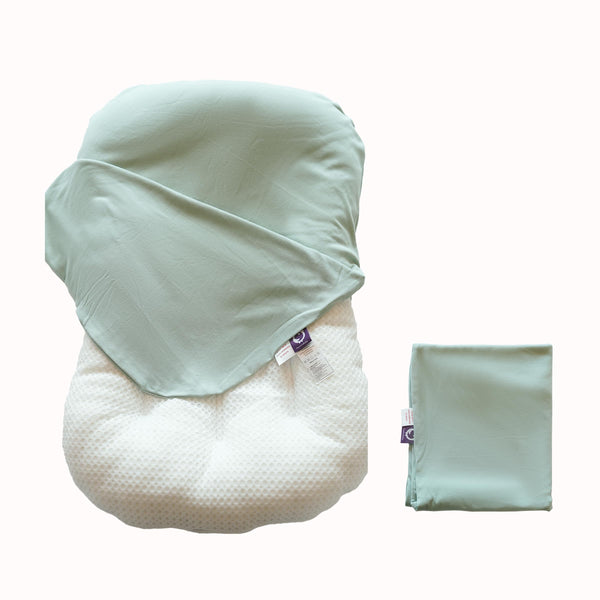 CooCooBaby sage green organic infant lounger cover cradling baby's skin.