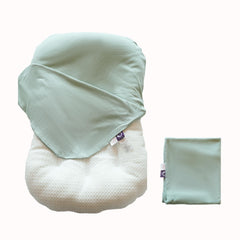 CooCooBaby sage green organic infant lounger cover cradling baby's skin.