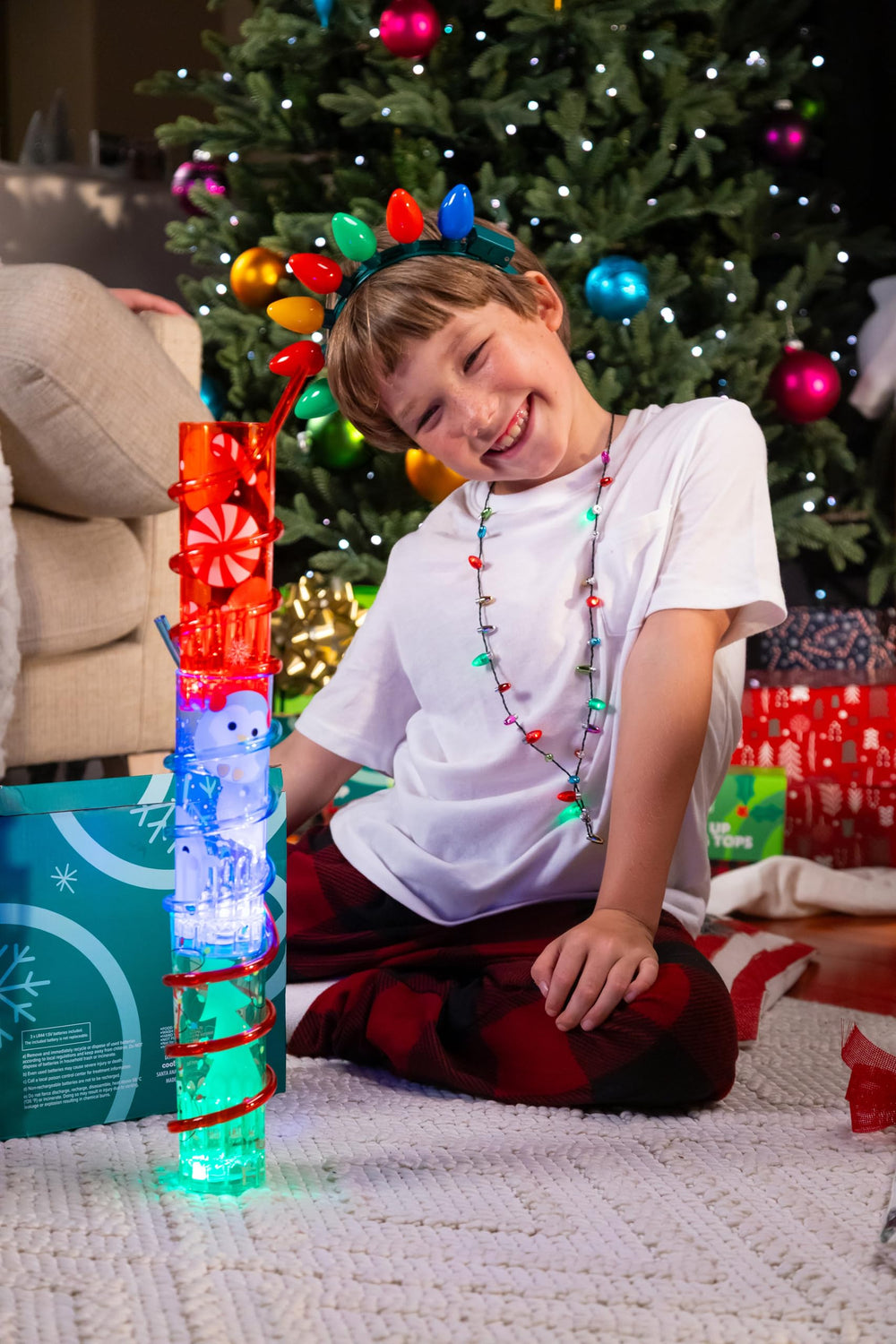Child toasting with Cool Things Corp glow cups during celebration