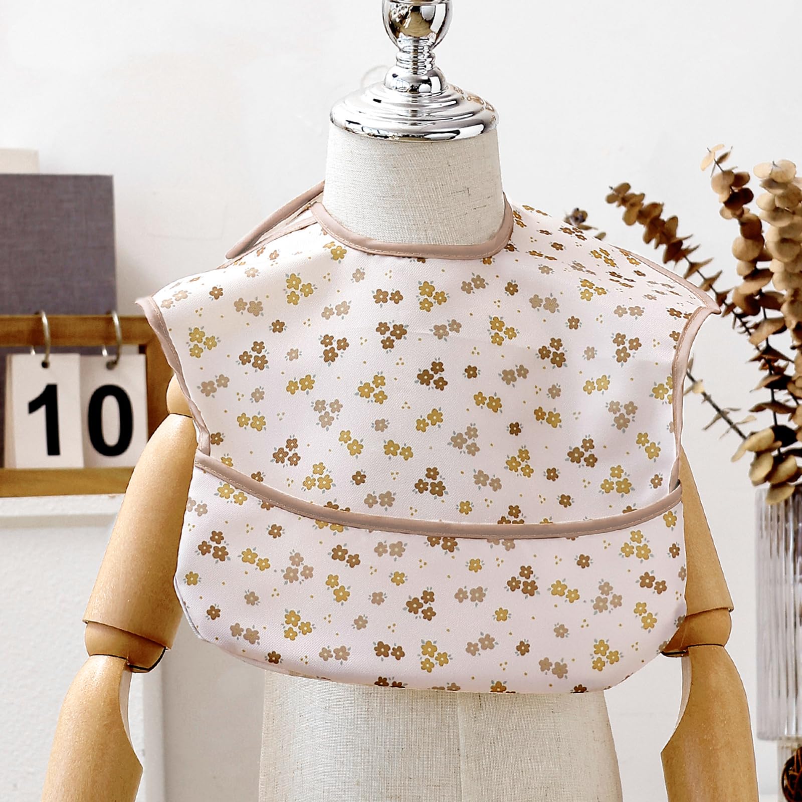 CoolaPeach food-catcher pocket bib captures crumbs