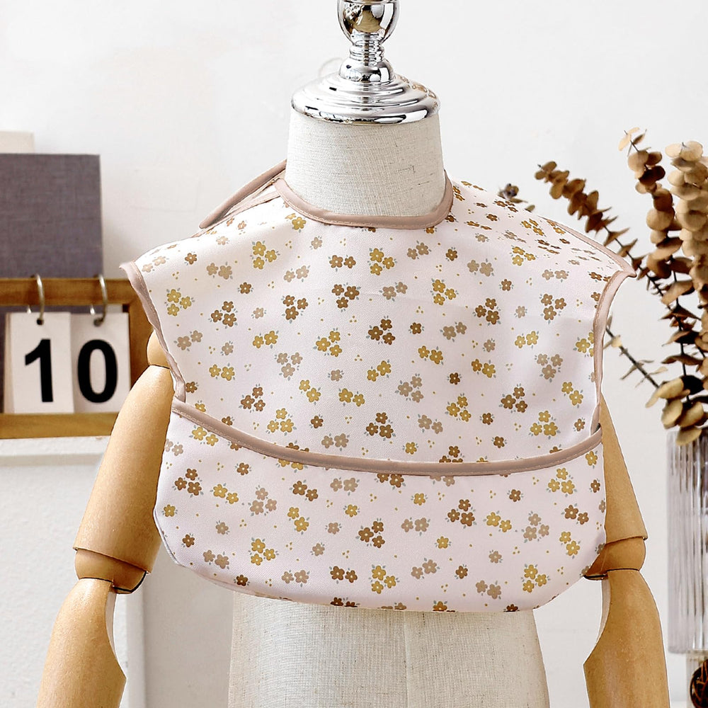 CoolaPeach food-catcher pocket bib captures crumbs