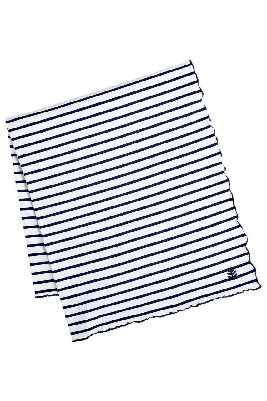 Coolibar Sun Blanket on the beach with UPF 50+ protection for sun safety.