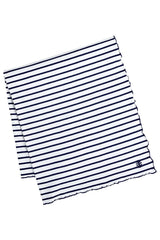 Coolibar Sun Blanket on the beach with UPF 50+ protection for sun safety.