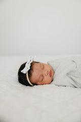 Copper Pearl Willow bow coordinates with swaddles for cohesive outfits.
