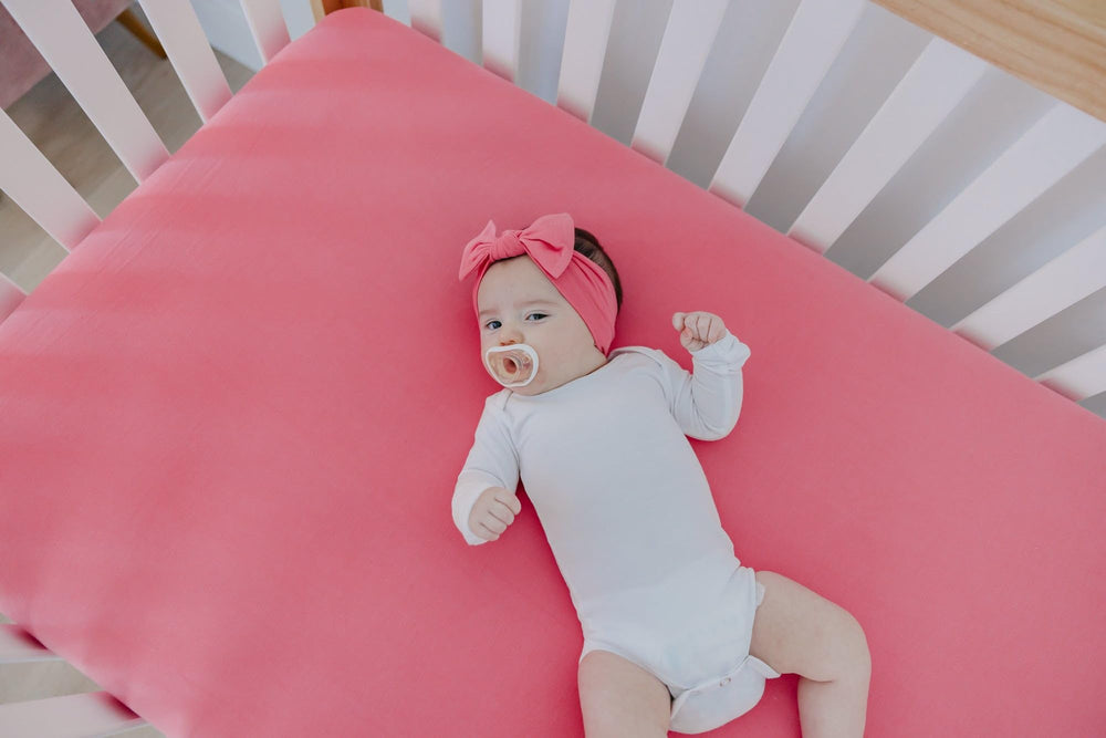 Copper Pearl newborn fit bow stays secure as baby grows.