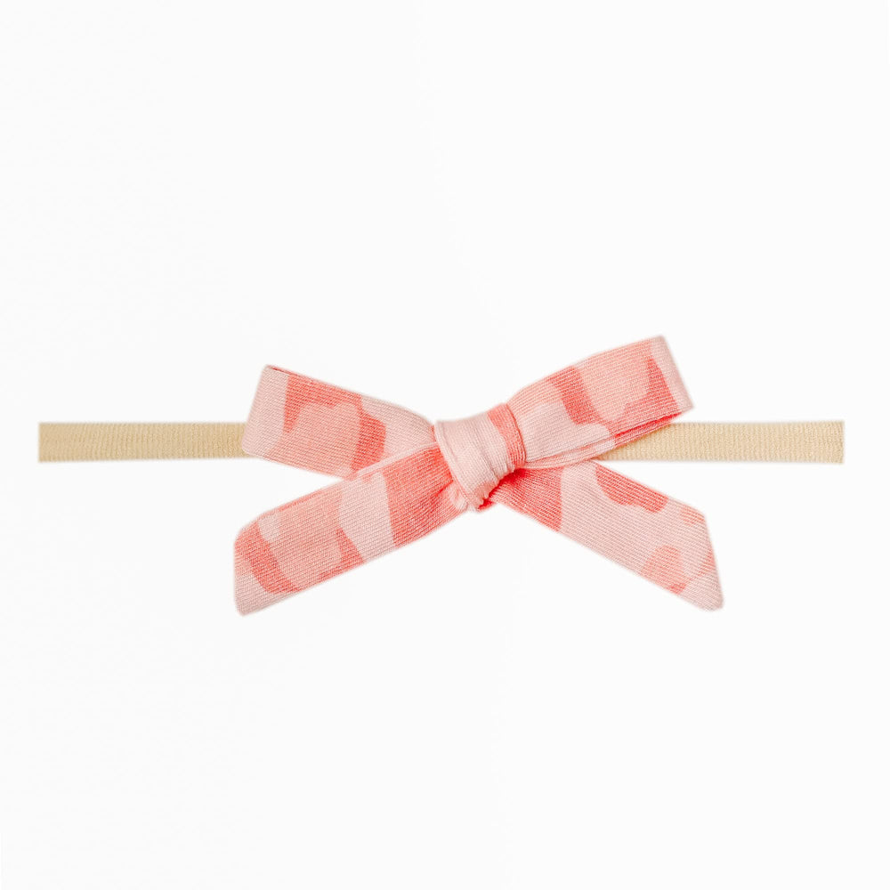 Copper Pearl Remi bow with flower design, ideal for newborn photo moments