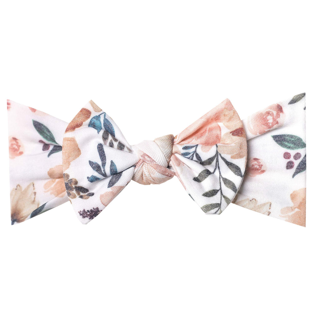 Copper Pearl baby bows soft headband on a newborn for gentle comfort.