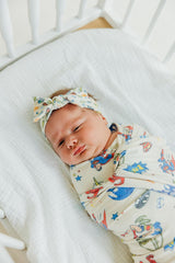 Copper Pearl stretchy headband adapts as baby grows for long-lasting wear.