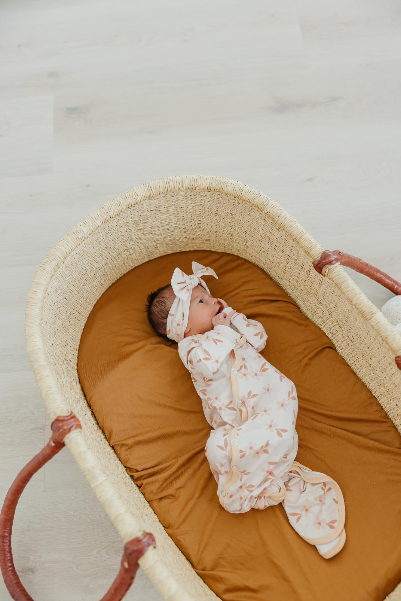 Soft fabric and adjustable fit ideal for newborns to babies.