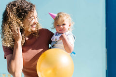 Copper Pearl nickel-free snaps show adjustable fit for growing babies.
