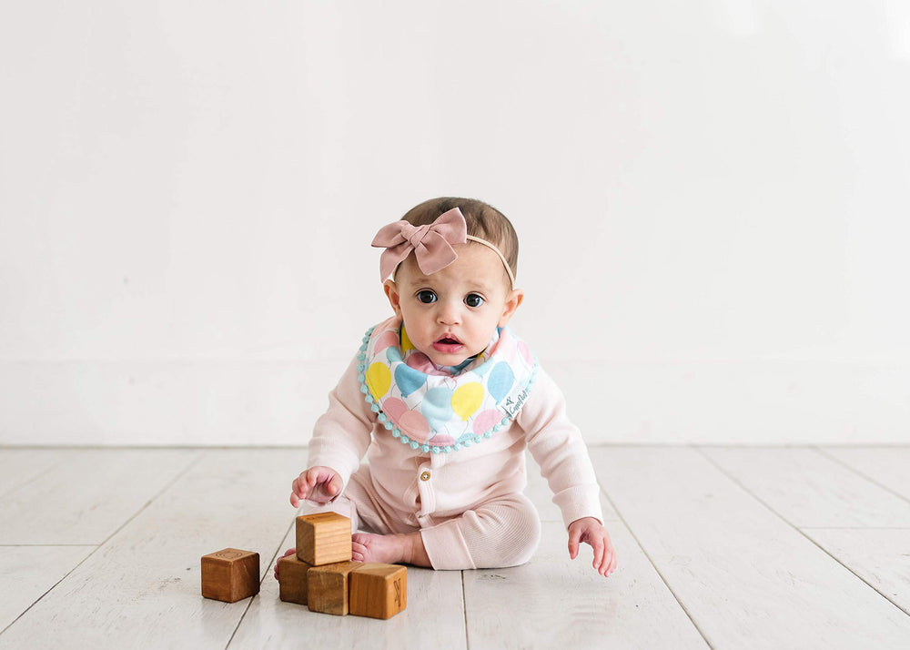 Copper Pearl bibs serve as a versatile photography prop for shoots.
