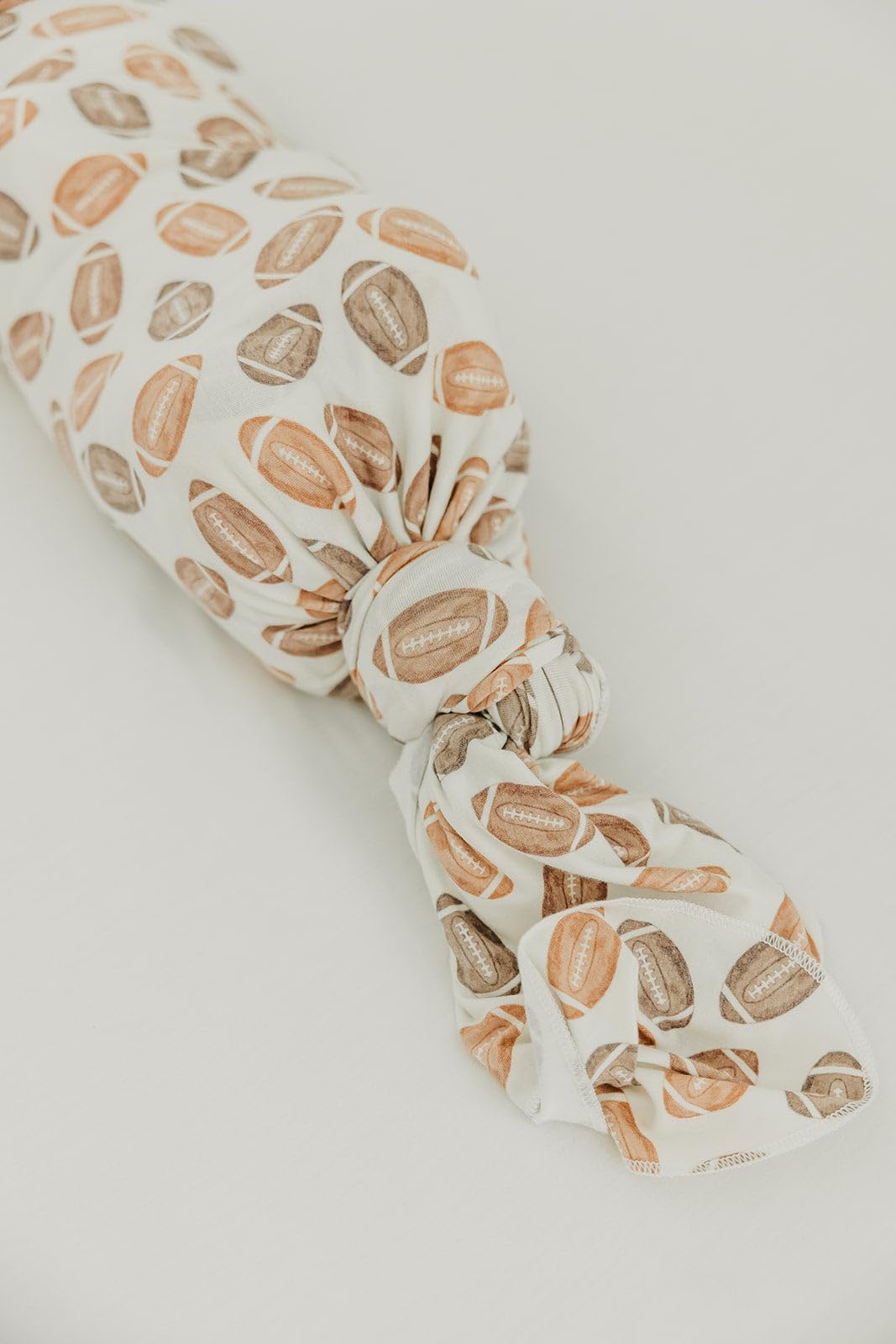 Copper Pearl Blitz swaddle blanket doubles as nursing cover for privacy