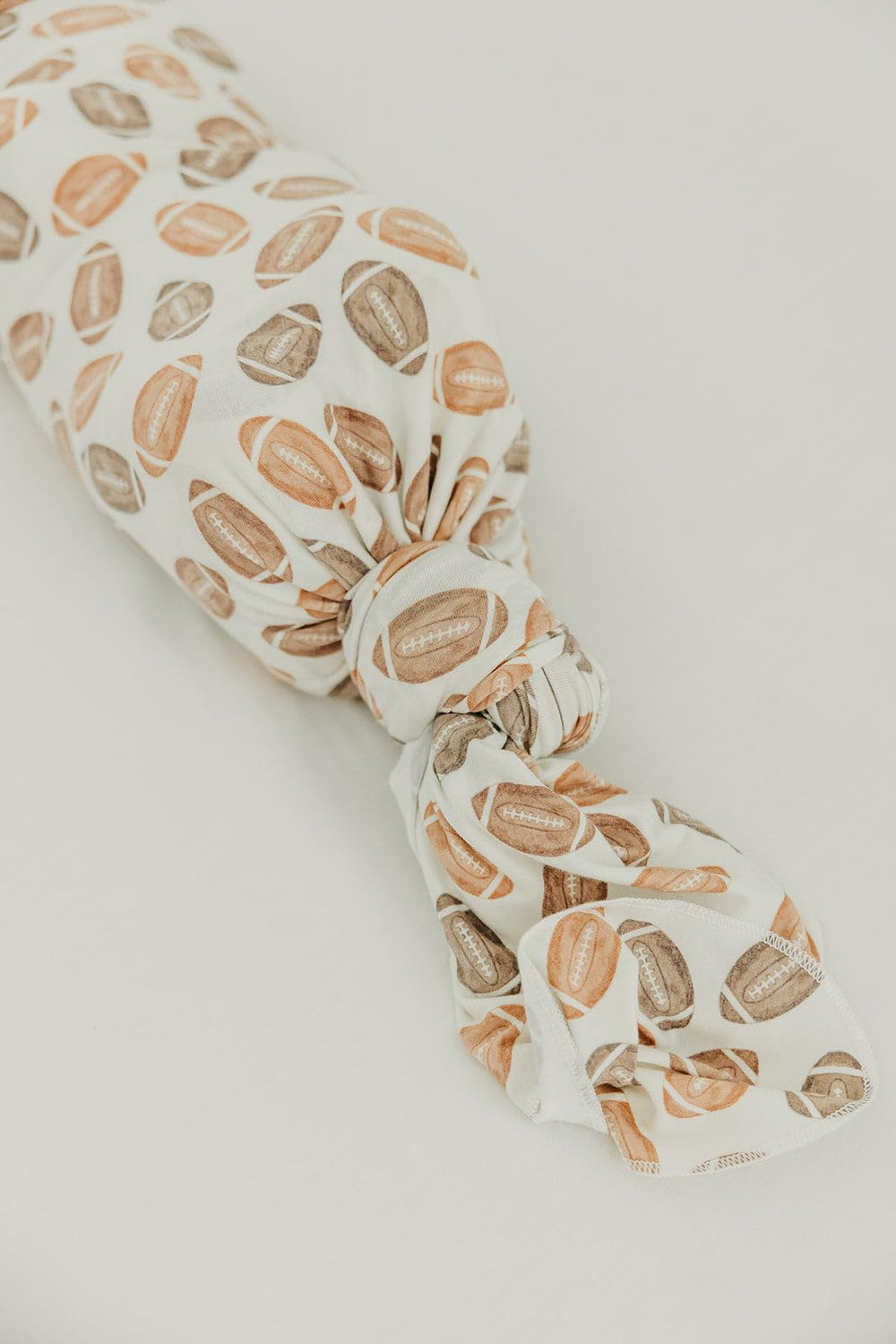Copper Pearl Blitz swaddle blanket doubles as nursing cover for privacy