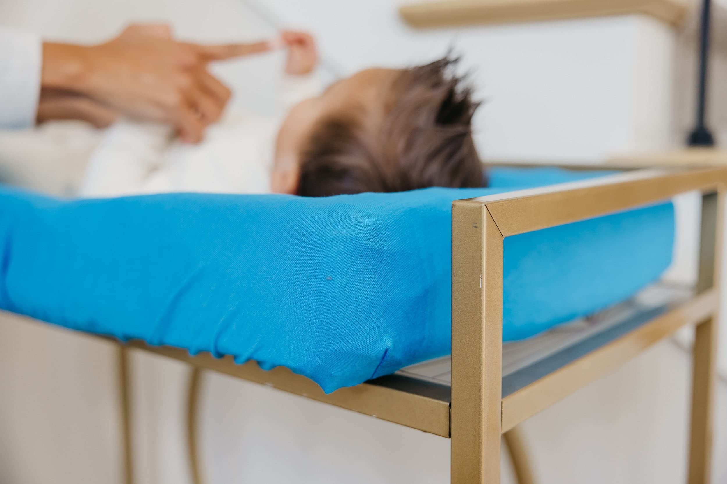 Copper Pearl Blueberry universal-fit cover on changing table demonstrates compatibility.
