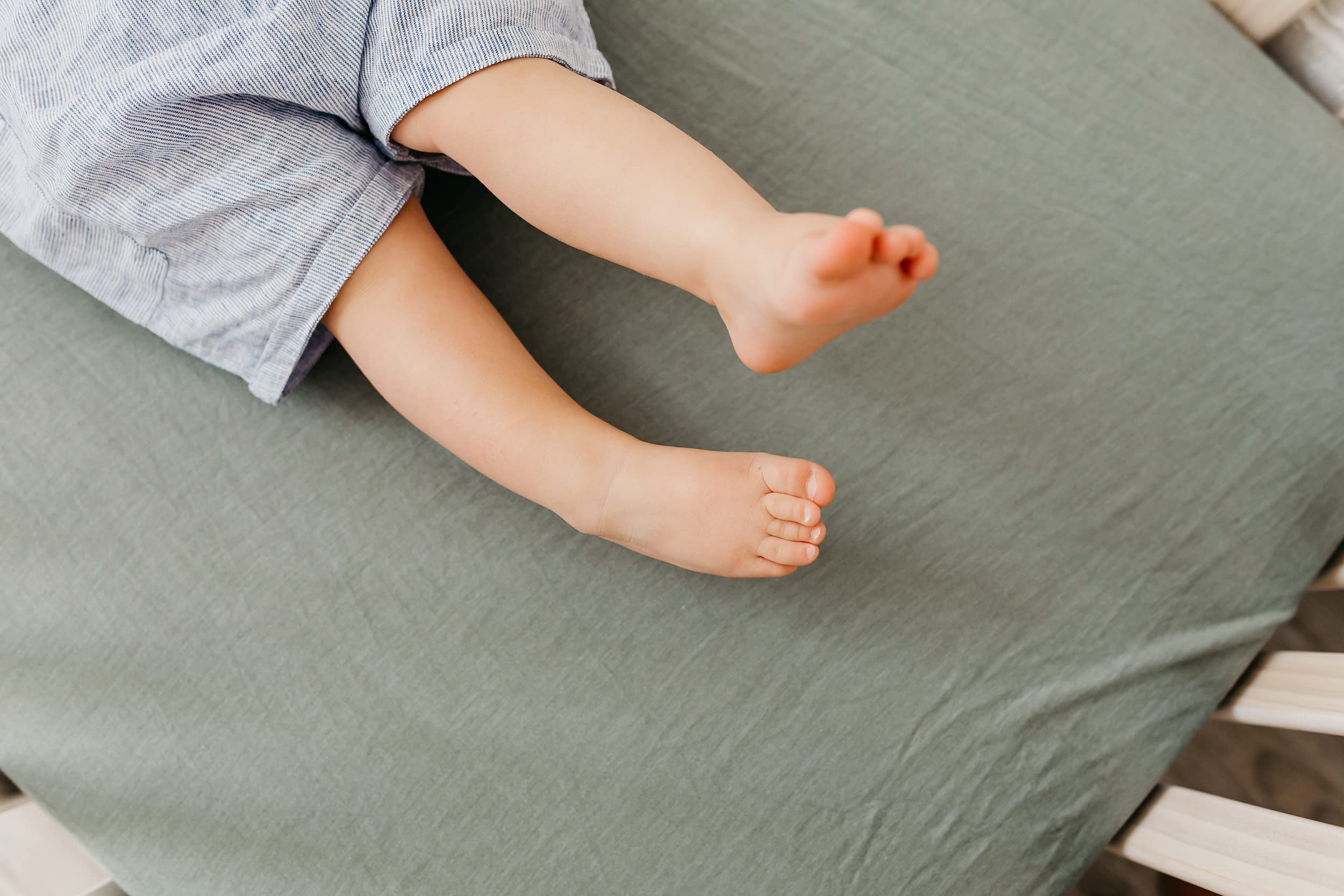 Copper Pearl Briar knit crib sheet with coordinating tones in a cozy nursery