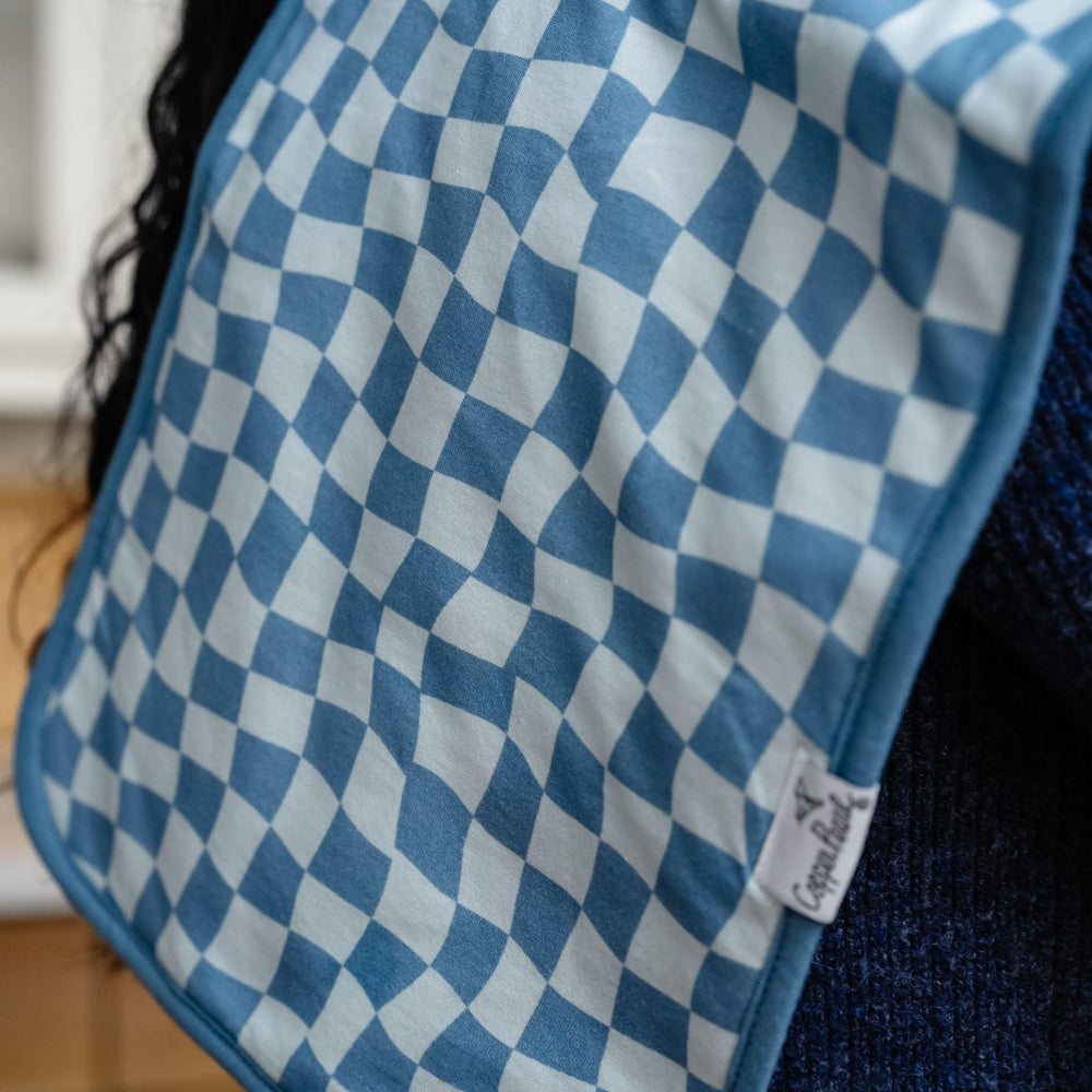 Copper Pearl oversized burp cloth protects outfits during feeding.
