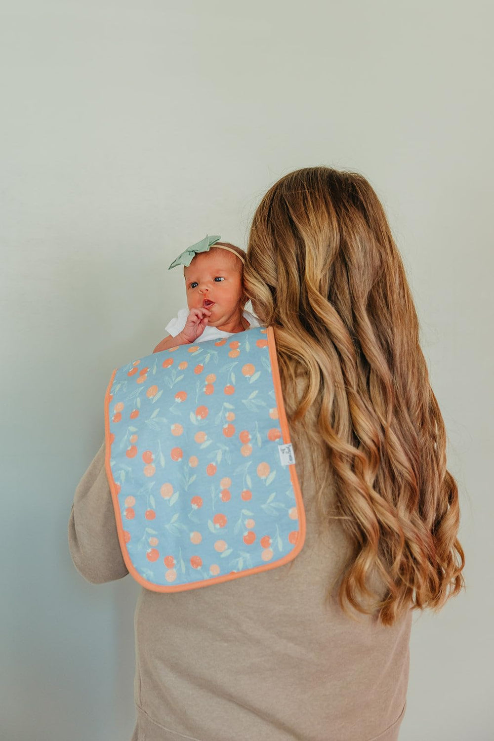Copper Pearl Clementine pattern burp cloths with soft cotton fronts and backs