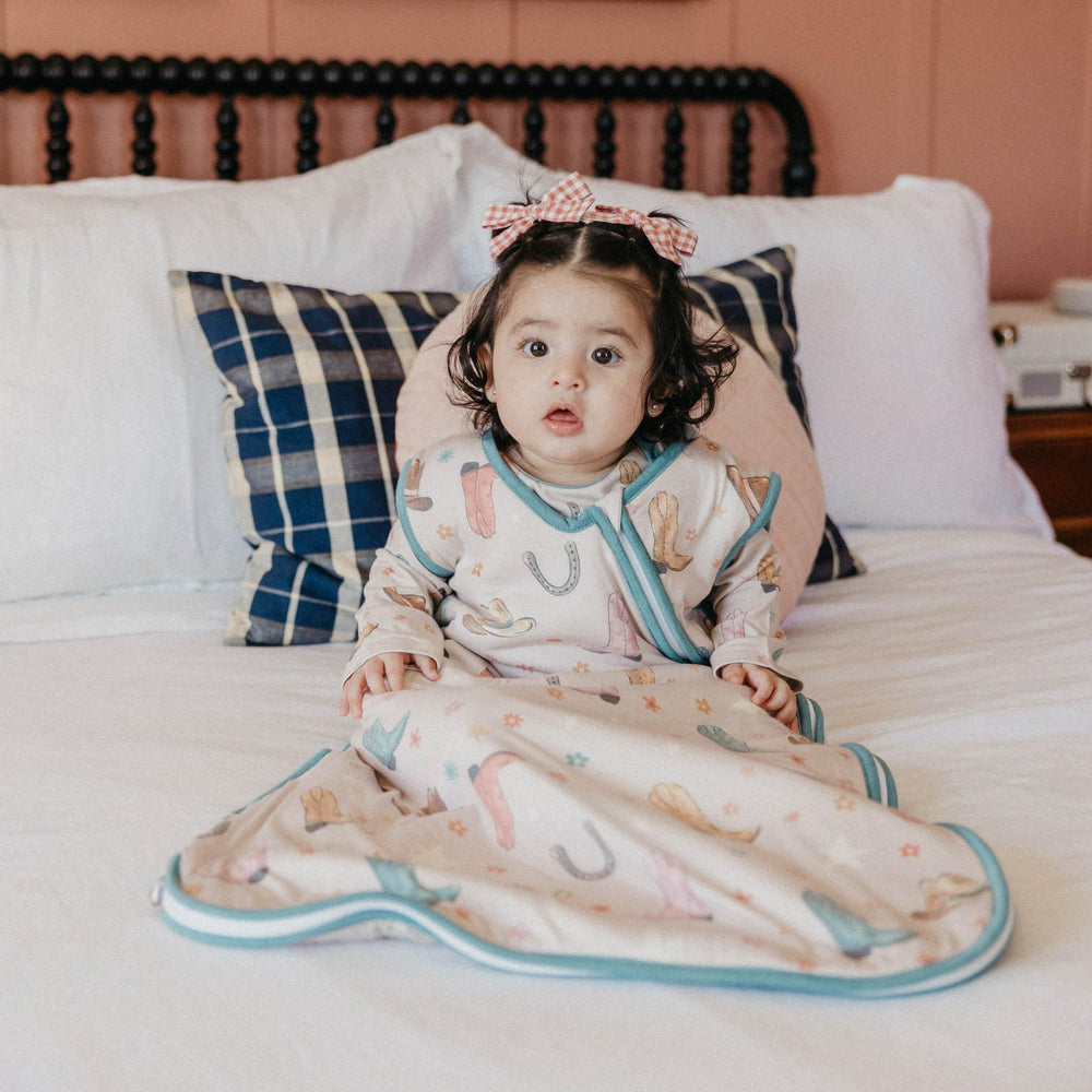 Copper Pearl Cheyenne baby in sleep bag during night routine