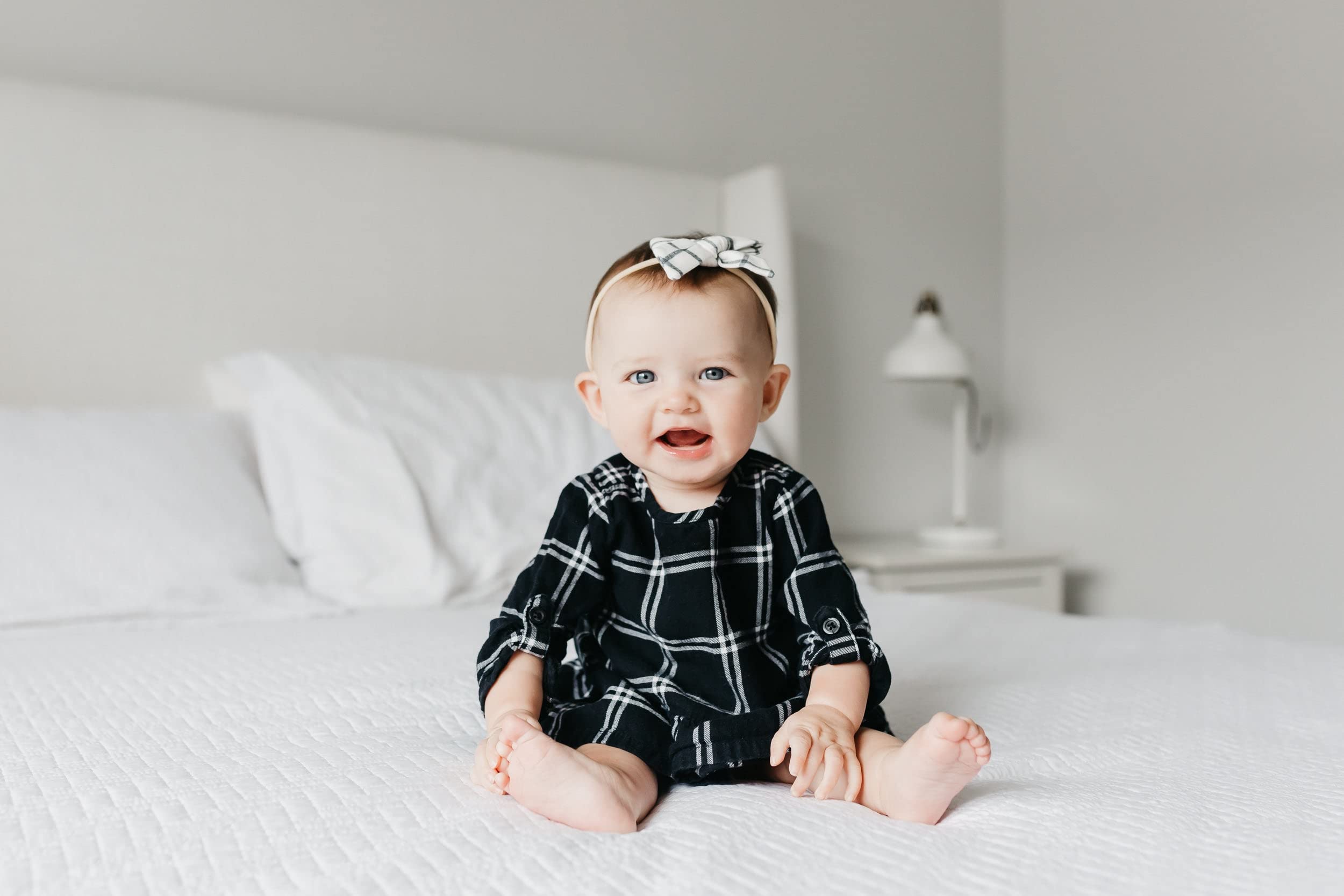 Copper Pearl Classic Baby Bow Ledger worn on newborn demonstrates gentle stretch