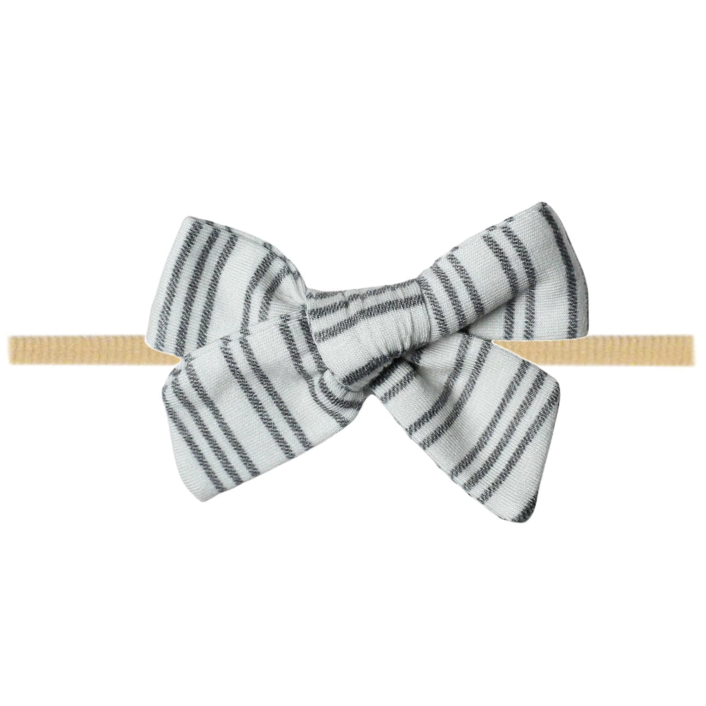 Copper Pearl Classic Baby Bow Midtown worn on a newborn for gentle comfort.