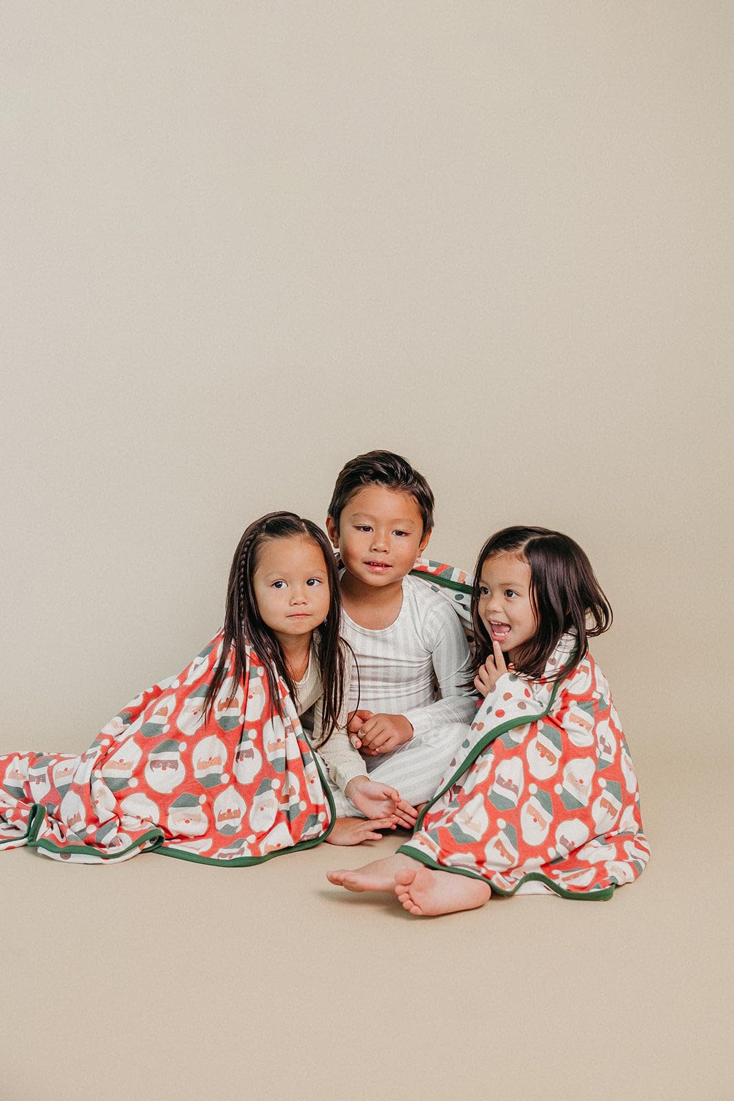 Copper Pearl Claus jumbo knit blanket on couch during family relaxation