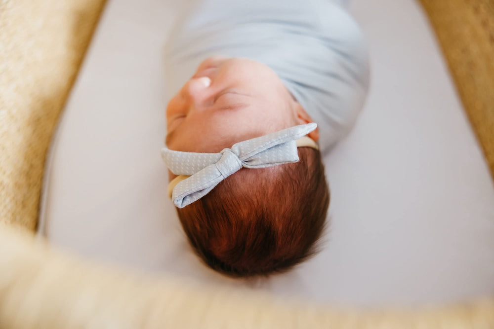 Copper Pearl newborn bows paired with Copper Pearl accessories for a coordinated look