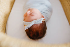 Copper Pearl newborn bows paired with Copper Pearl accessories for a coordinated look