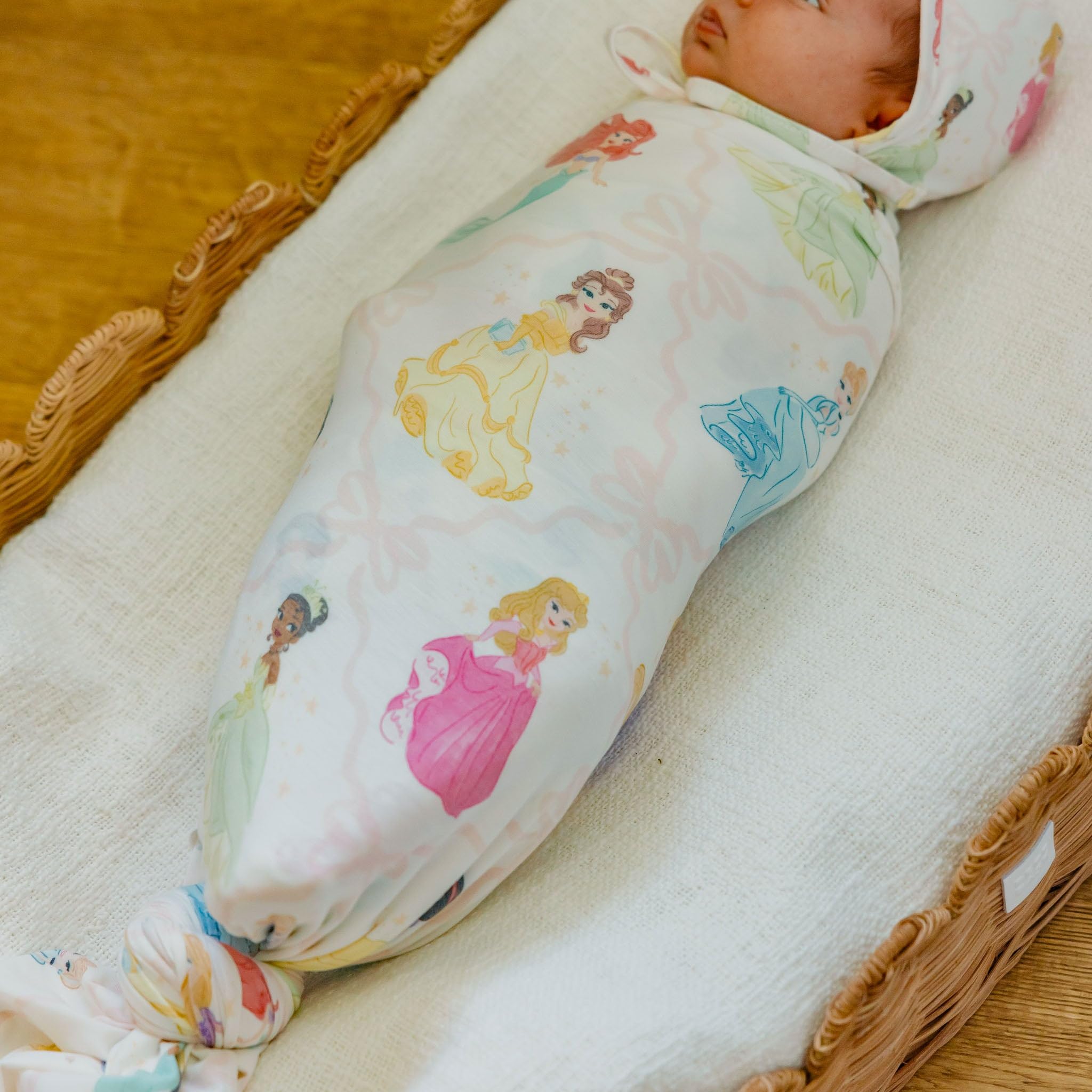 Copper Pearl Disney Princess knit swaddle on a nursery shelf, gift-ready