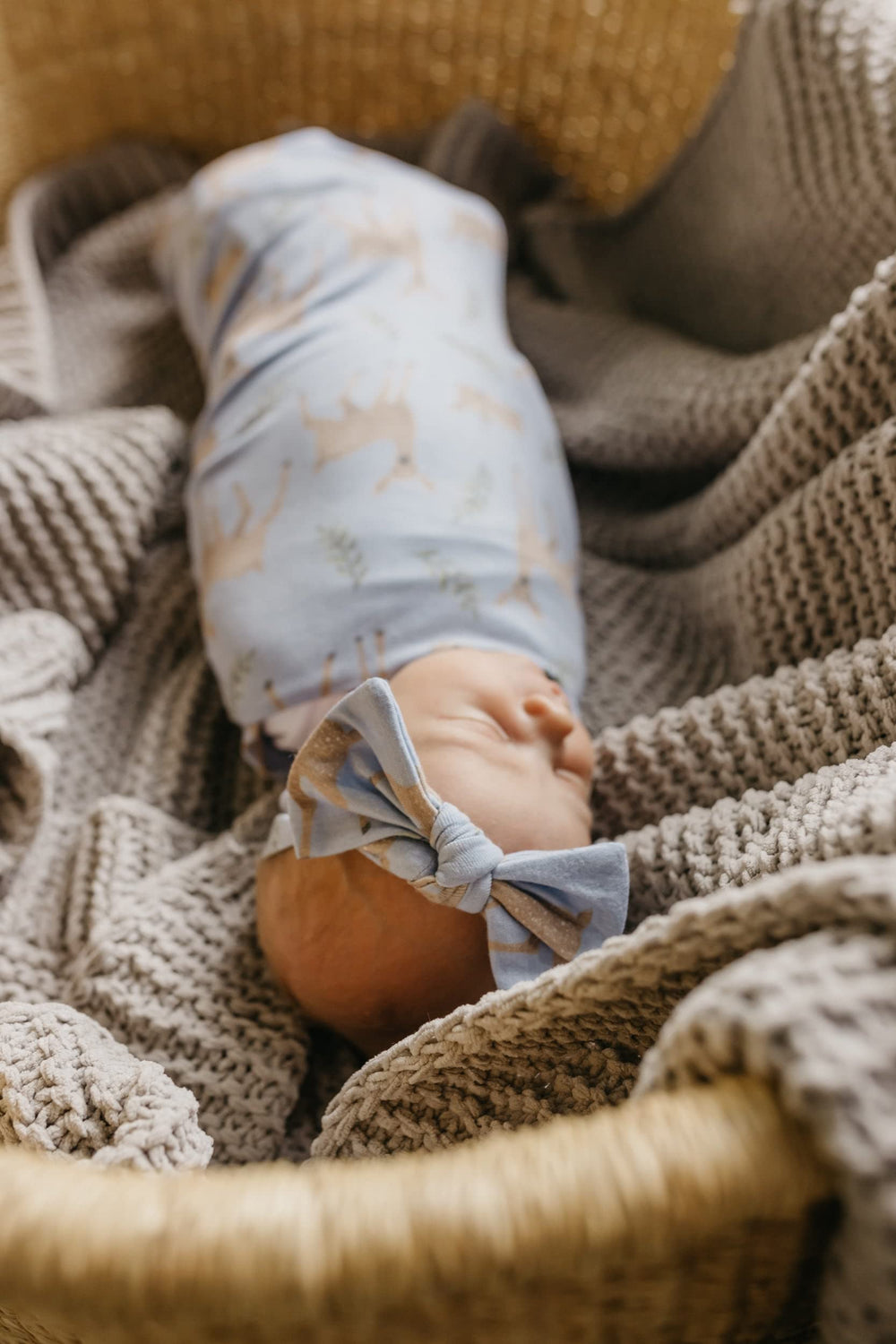 Copper Pearl Doe swaddle blanket shown as stroller cover for on-the-go warmth.