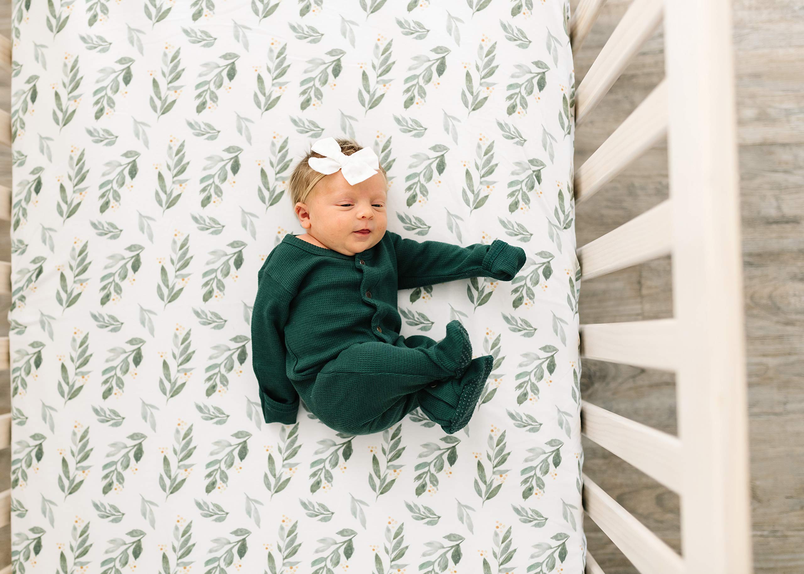 Copper Pearl fern premium knit crib sheet on mattress with full-elastic edge