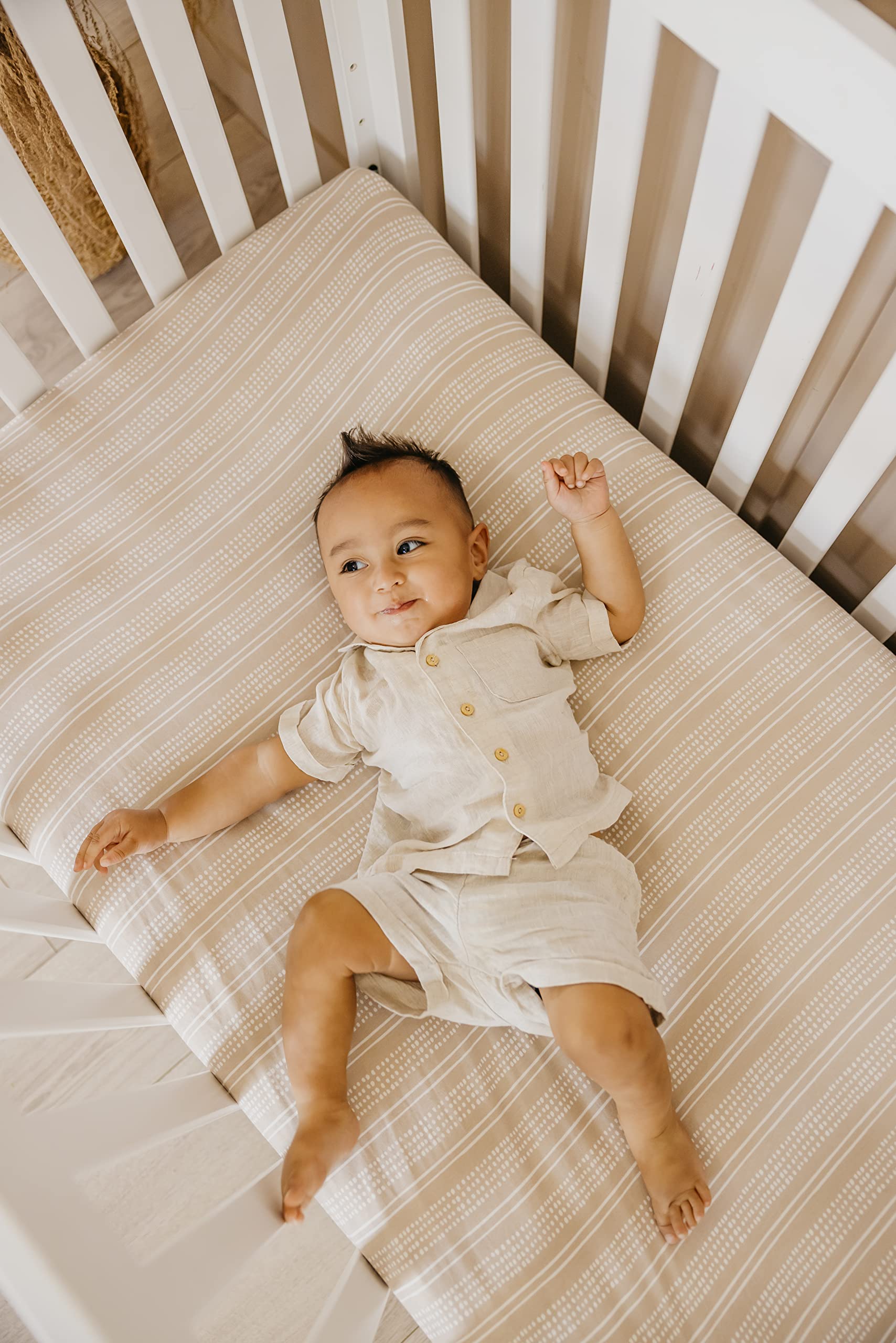 Copper Pearl fitted crib sheet elastic all around; secure fit for tidy nursery.