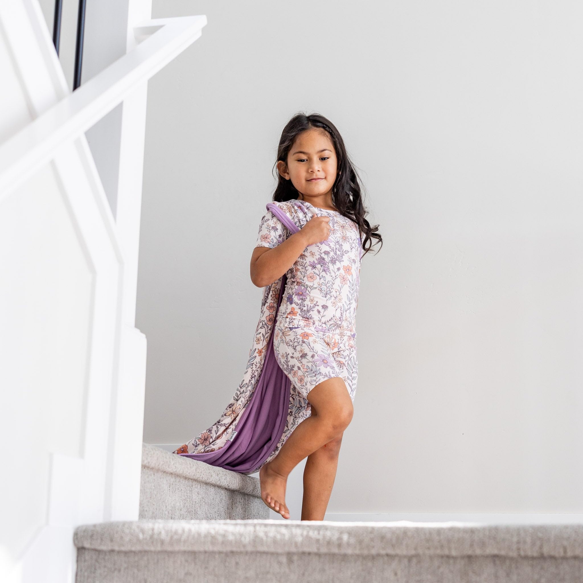 Copper Pearl Flora three-layer-quilt emphasizes durability with serged edges for lasting use.