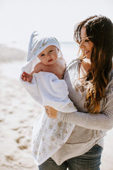 Copper Pearl hooded bath towel features a hood and pockets to keep heads and hands warm.