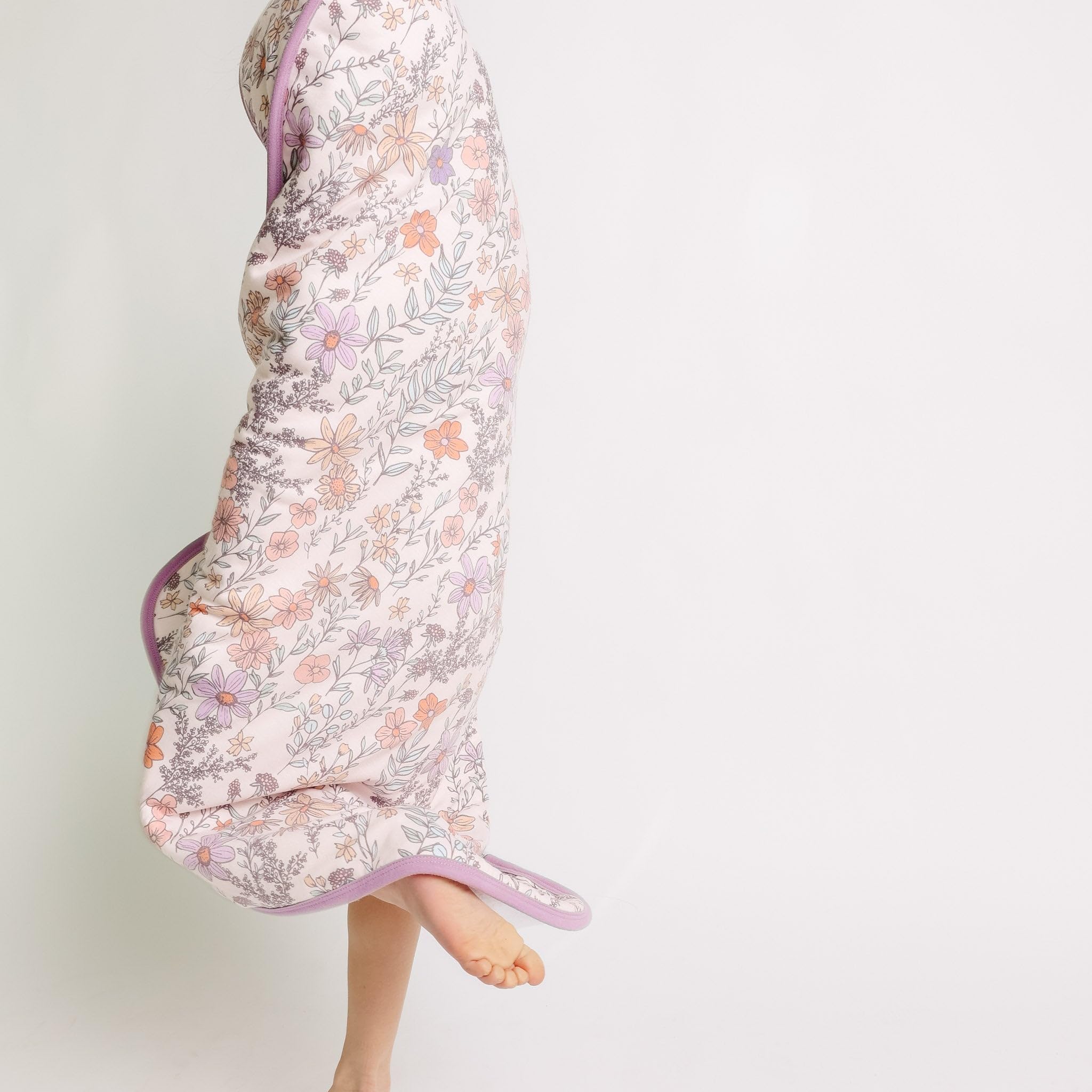 Copper Pearl Flora towel in nursery scene—stylish bath time accessory.