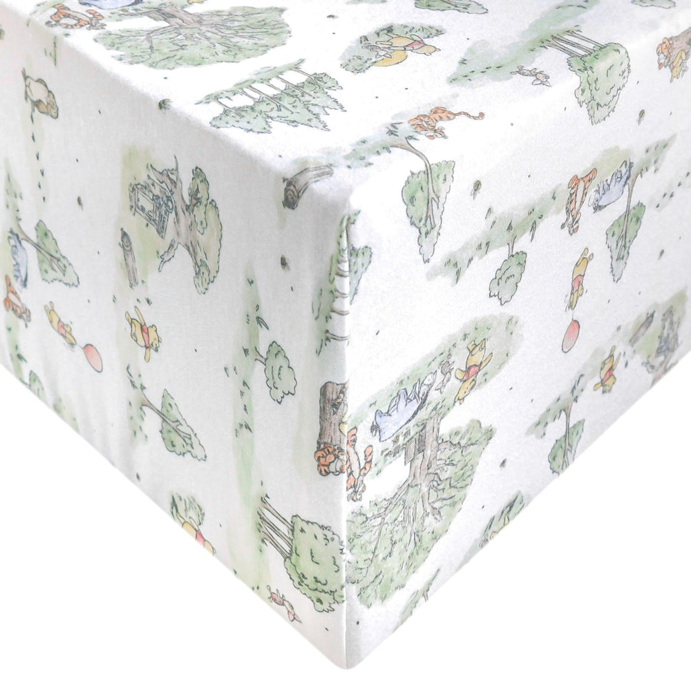 Copper Pearl Hundred Acre Wood knit crib sheet shows soft, breathable fabric for a comfy nursery
